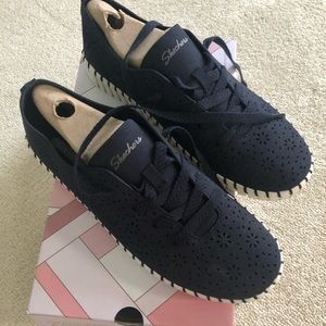 Sketchers floral maze sneakers in navy blue.